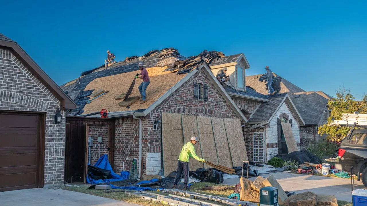 Roofing crew doing a roof replacement on a Franklin County home