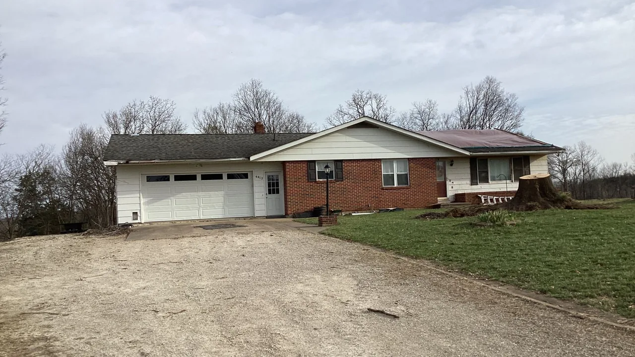 House with minor roof damage after a tornado